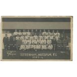 Tottenham Hotspur 1923/24. Mono real photograph postcard of the team and officials, standing and