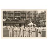 Mono candid-style real photograph plain back postcard of the Australian team standing informally