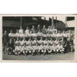 Tottenham Hotspur 1949/50. Mono real photograph postcard of the team and officials, standing and