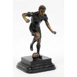 Football figure. Large and impressive bronze/spelter [?] figure of a footballer running with the