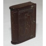 Vesta case. Unusual Victorian bakelite brown vesta case, modelled as a book, depicting a golfer to