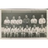 Tottenham Hotspur 1948/49. Mono real photograph postcard of the team, standing and seated in rows.