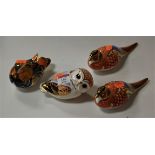 A collection of four Royal Crown Derby bird table ornaments to include owl and duck examples, each