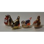 Four various Royal Crown Derby bird table ornaments, each decorated in variations of the Imari