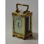 An early 20th century lacquered brass carriage clock, having visible platform escapement,