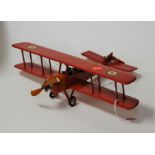 A painted softwood model of a biplane, with RAF decals, wingspan 45cm