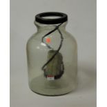 A contemporary glass vessel/storm-lantern, with inset candle holder