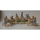 An 'Irish Dresden' crinoline porcelain group, entitled Wedding Game; together with a pair of