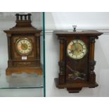 A late 19th century continental beech cased wall clock having enamelled chapter ring with Roman