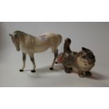 A Beswick model of dapple-grey stallion, gloss finish, h.17cm; together with a Beswick cat (2)