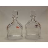 A pair of Orrefors glass decanters and stoppers, each etched with hunting scene and signed Felix