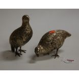 A pair of silver plated models of game-birds, being naturalistically posed, h.17.5cm