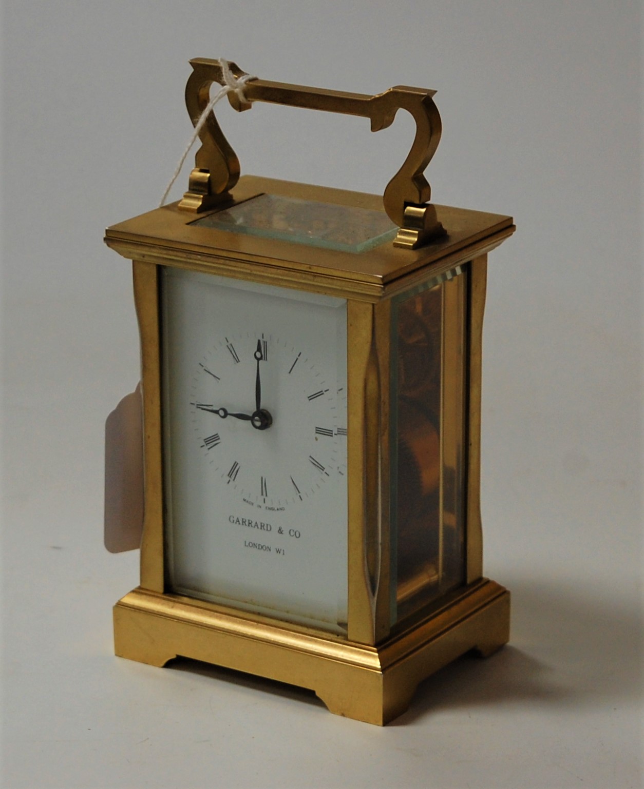 A contemporary brass carriage clock as retailed by Garrard & Co having ...
