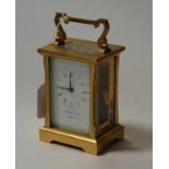 A contemporary brass carriage clock as retailed by Garrard & Co having single barrel going movement,