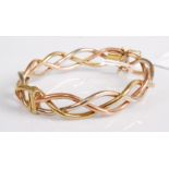 A 9ct three-colour gold hinged bangle, 19.2g, 7cm