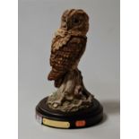 A Royal Doulton tawny owl DA156 No. 365/2500, matt finish, and on wooden plinth, height 29cm