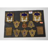 A display of pressed brass and enamel masonic badges, to include three for the Hunston Lodge No.