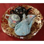 Four novelty teapots to include lustre glazed example together with a large ruby glass bowl