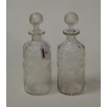 A pair of Victorian thumb cut and acid etched decanters and stoppers, h.26cm