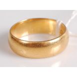 A 22ct gold wedding band, 7.3g, size N