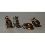 Four various Royal Crown Derby cat ornaments, each decorated in the Imari palette, the largest
