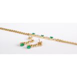 A contemporary 18ct gold, emerald and diamond point set bracelet, the three four-claw set oval cut