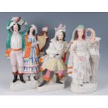 A large Victorian Staffordshire flatback figure group of a lady and gent, each in standing pose, him