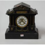 A Victorian slate mantel clock with brass detailing and visible escapement, height 37cm