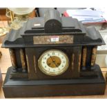 A late Victorian slate mantel clock of architectural outline having eight day movement striking on a