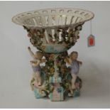 A continental porcelain basket centrepiece, 20th century, h.31cm