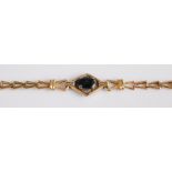 A 14ct gold and single sapphire set bracelet, 5.2g, 18cm