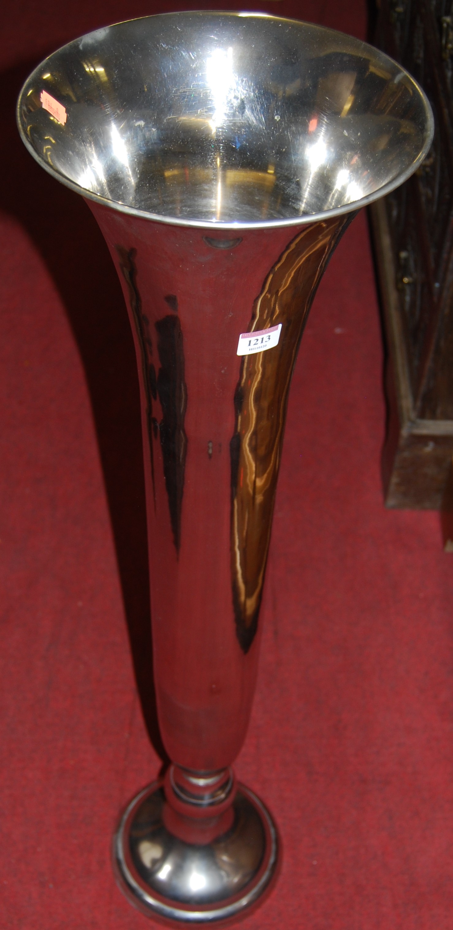 A contemporary chromed metal trumpet form floor vase, height 100cm
