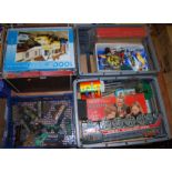 Four boxes containing a large quantity of mixed children's puzzles, 0 gauge trains, Dinky toys