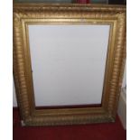 A large 19th century giltwood and gesso rectangular picture frame, having raised acanthus outer