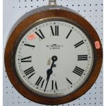 A 1930s Elliott circular wall clock, the white enamel 10" dial signed W. Mansell Lincoln