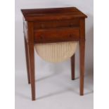A circa 1830 rosewood needlework table, the top drawer fitted for writing, over another drawer