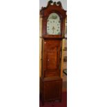 A circa 1800 provincial oak and mahogany crossbanded longcase clock, having an arched painted