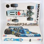 A Tamiya 1/12 scale plastic F1 classic car kit group to include a factory sealed model No. 1211-2800