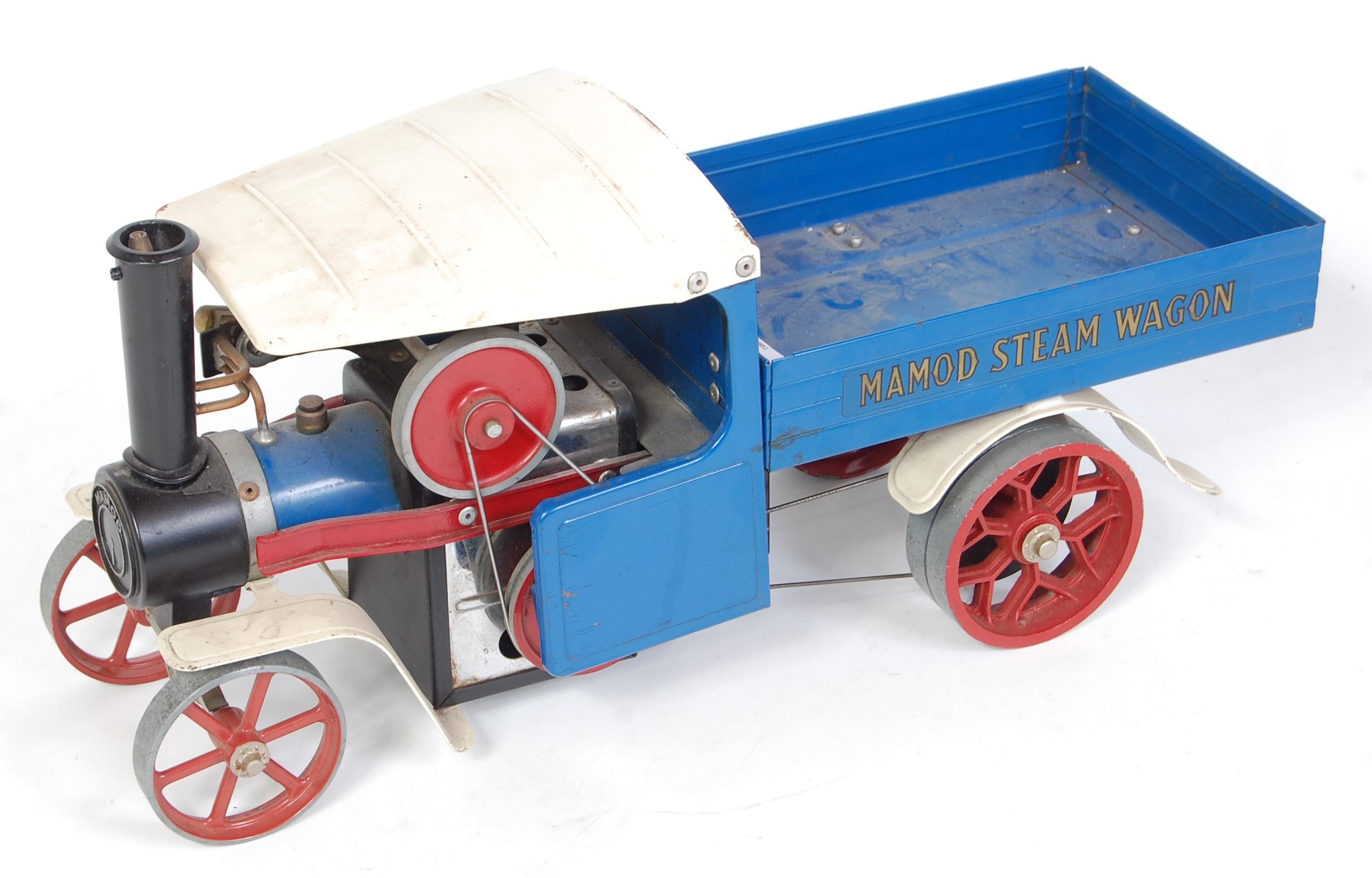 A Mamod SW1 steam wagon comprising blue & white body with red hubs, used condition (loose)
