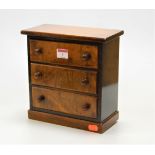 An early 20th century walnut apprentice piece chest of three long drawers, on plinth base, w.23cm