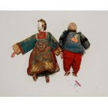 An early 20th century Chinese composition doll, in blue silk robe; together with another similar