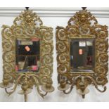 A pair of mirrored glass girandole, each with bevelled plates and scrolled decorationCondition