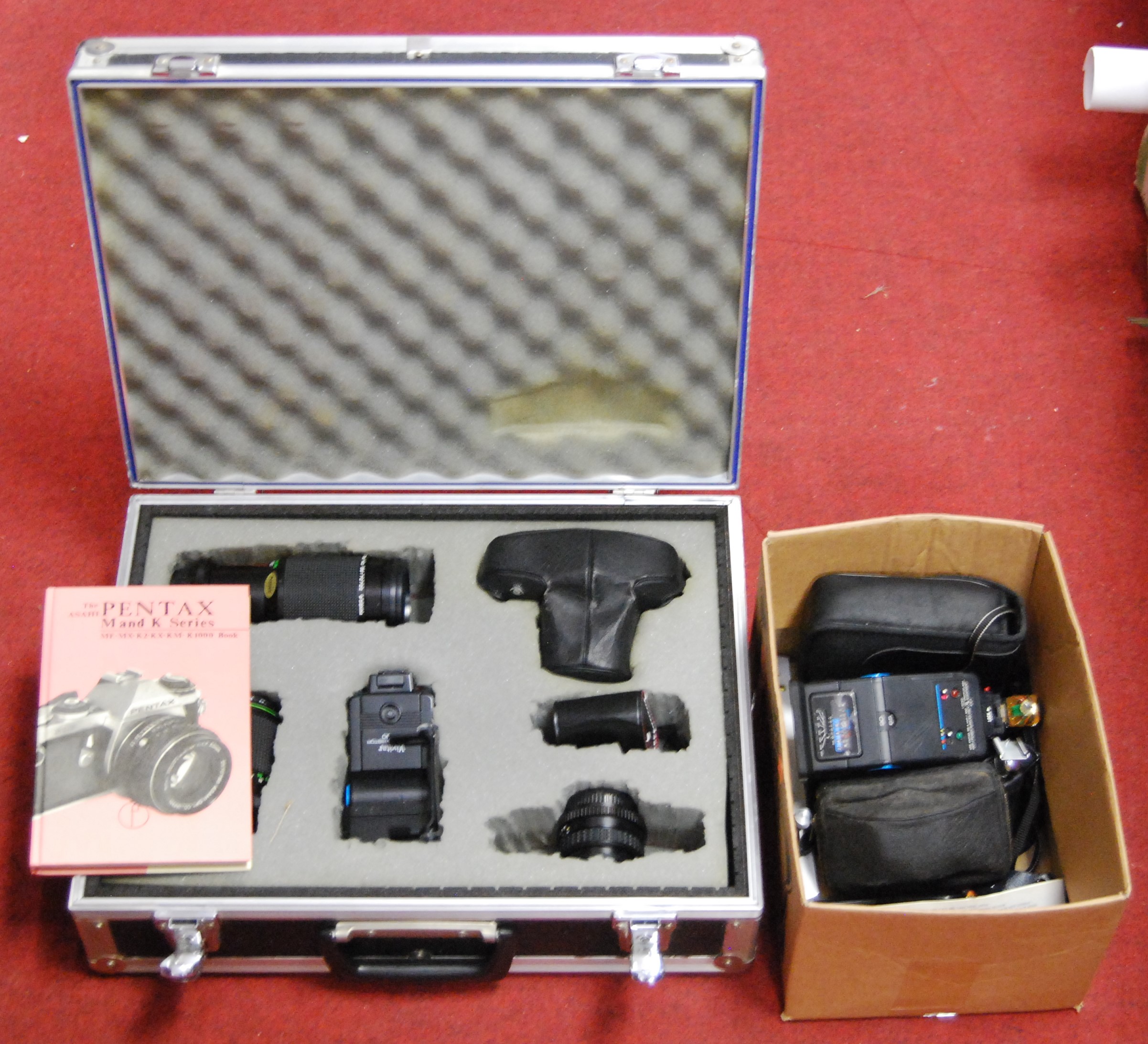 A Pentax ME series camera, in fitted case with various lenses and accessories; together with various