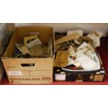 Two boxes containing a quantity of mixed effects, to include ephemera, photographs, stamps,