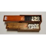 A set of bone and ebony dominoes in boxwood case; together with another set (2)
