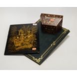 An early 20th century lacquered and gilt decorated folio blotter; together with a burgandy leather