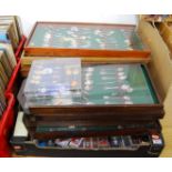 A large quantity of mixed souvenir spoons, the majority housed in display cases