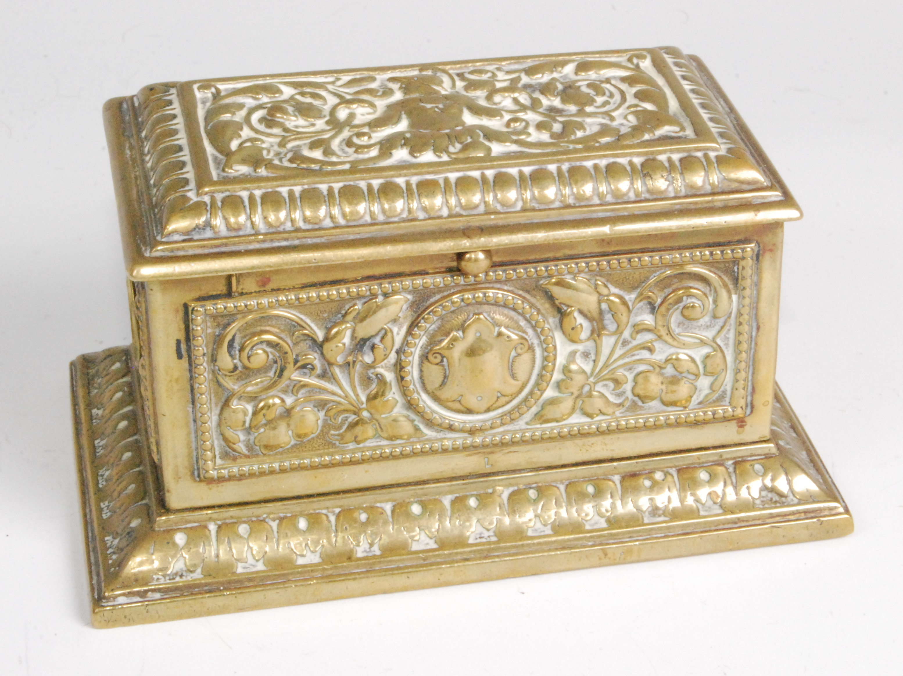 A Victorian brass table cigar box with integral cutter, of rectangular form, having all-over