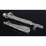 An early 20th century steel and continental silver clad cigar cutter, the silver mounts decorated