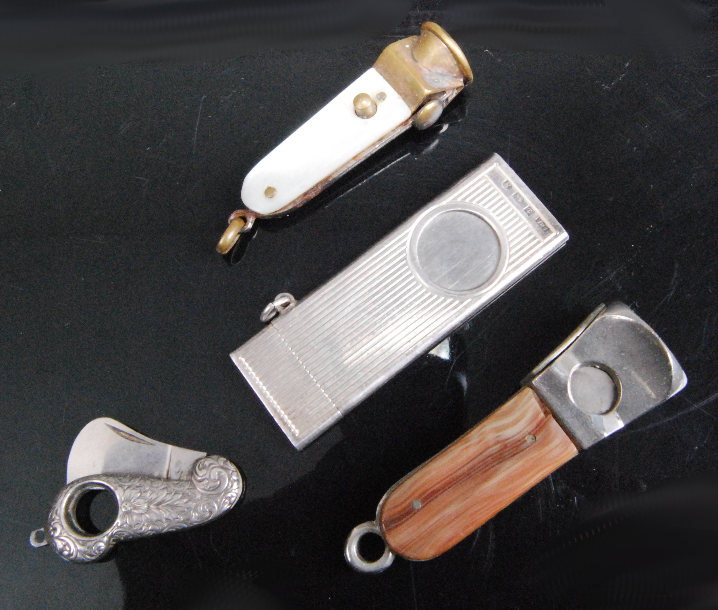 A modern silver guillotine pocket cigar cutter of lined rectangular form, maker SJ Rose & Son,